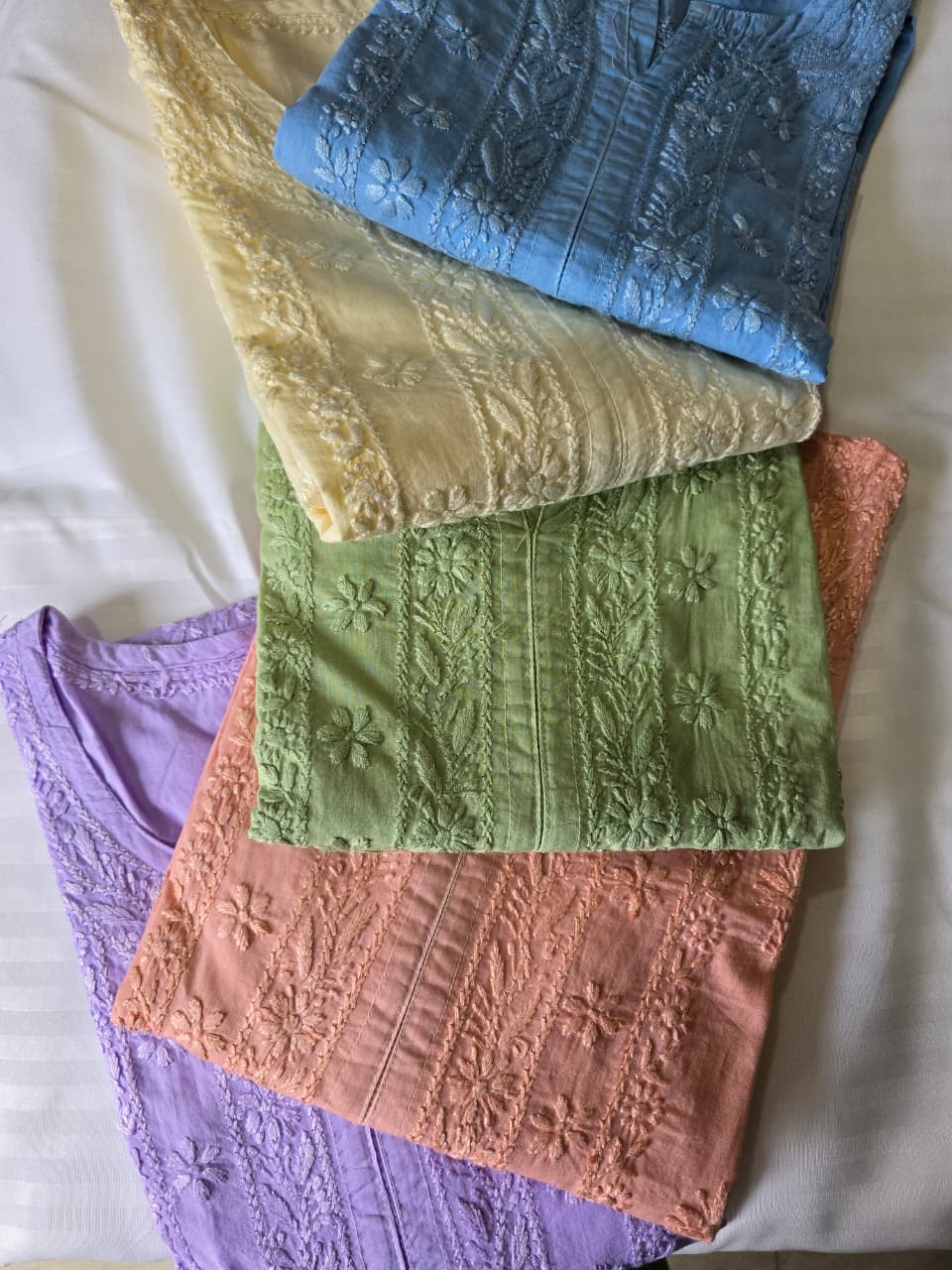 Pastel chikankari fabric stack